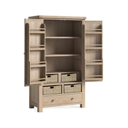 Wooden freestanding kitchen larder with open doors and storage baskets on a white background