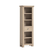 Slim oak bookcase with a single drawer. 