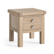 Wooden side table with two drawers on a white background