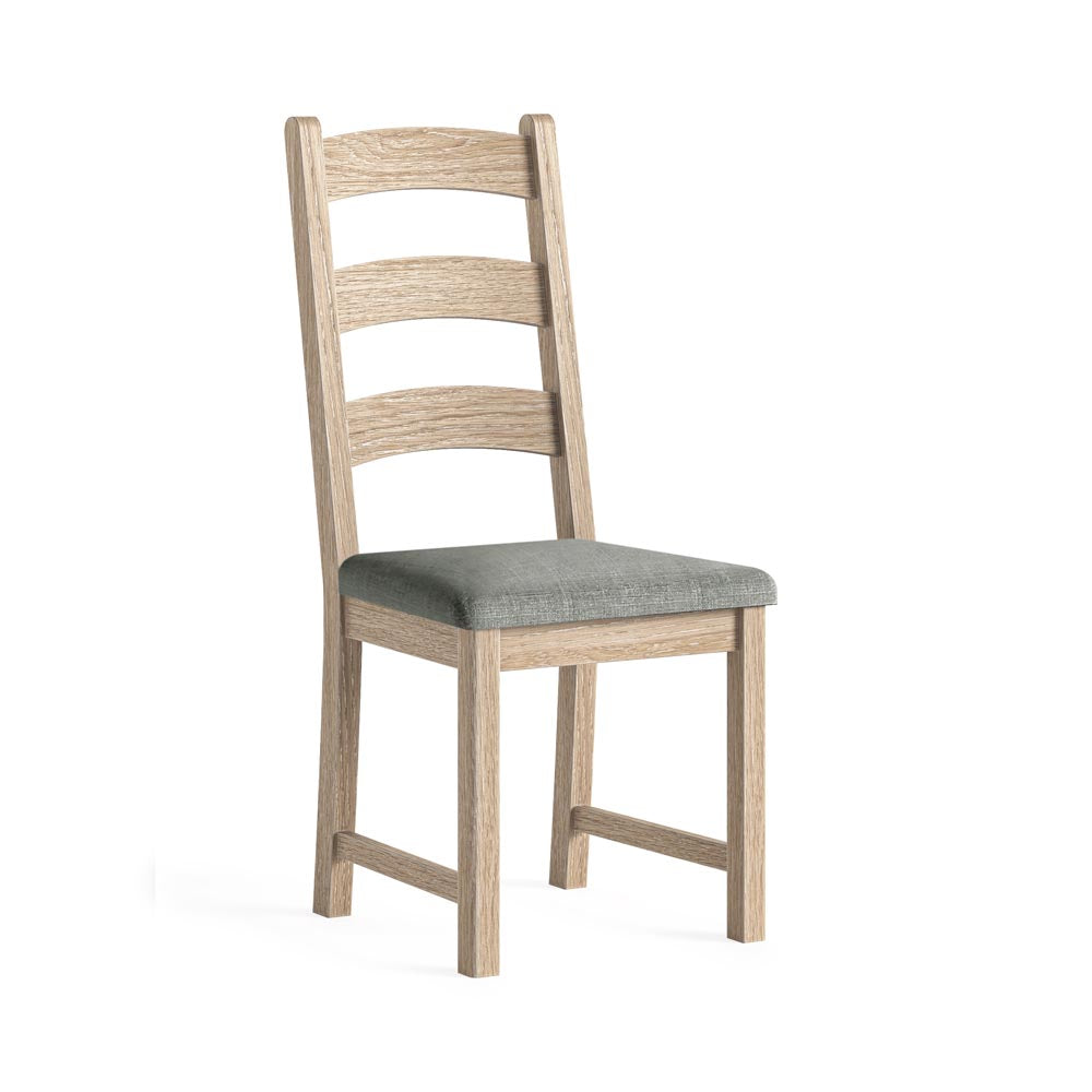 Wooden chair with a grey cushion on a white background