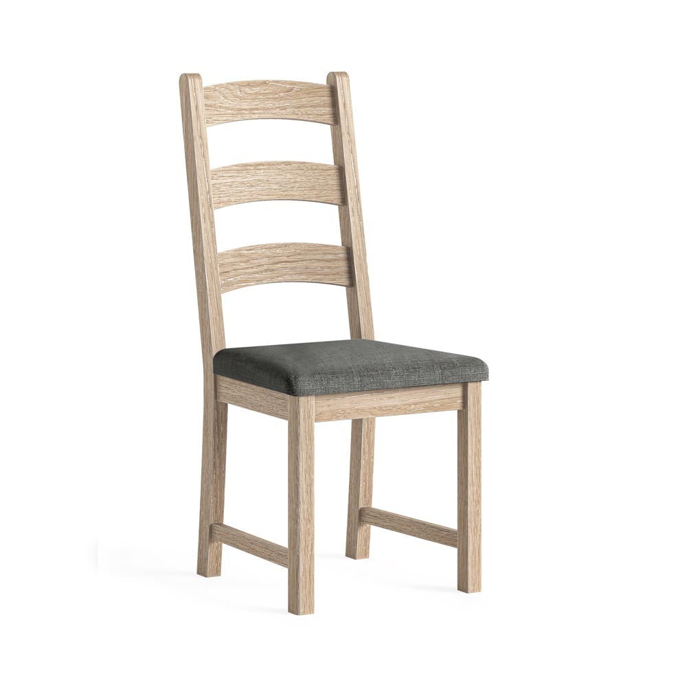 Wooden chair with a charcoal gray cushion on a white background