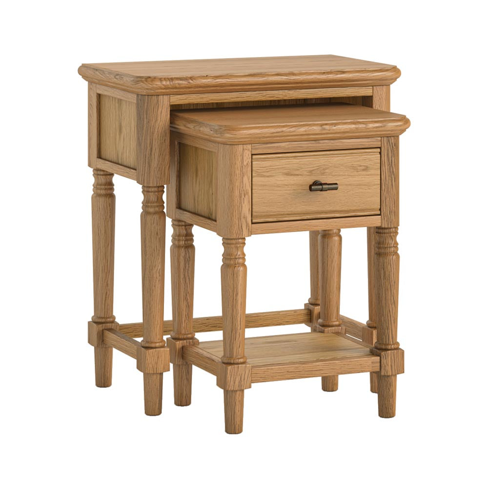 Set of two nesting wooden side tables, one with drawers on a white background