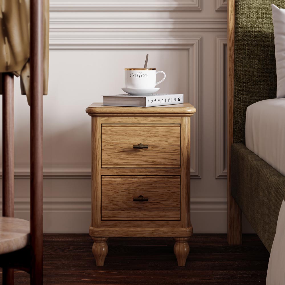 Wooden nightstand with a cup of coffee and books in a bedroom setting