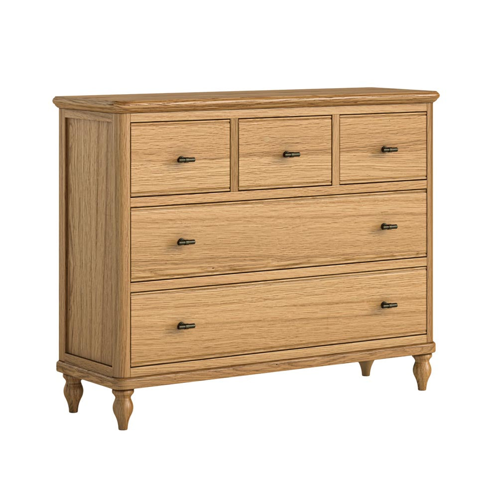 Wide oak dresser with 5 drawers (3 over 2) on a white background