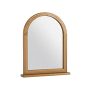 Wooden-framed mirror with arched top on a white background