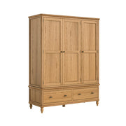 Wooden wardrobe with three doors and two drawers on a white background