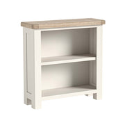 White bookshelf with a wooden top on a white background