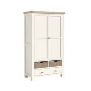 White freestanding kitchen larder with two doors and a drawer with woven baskets on a white background