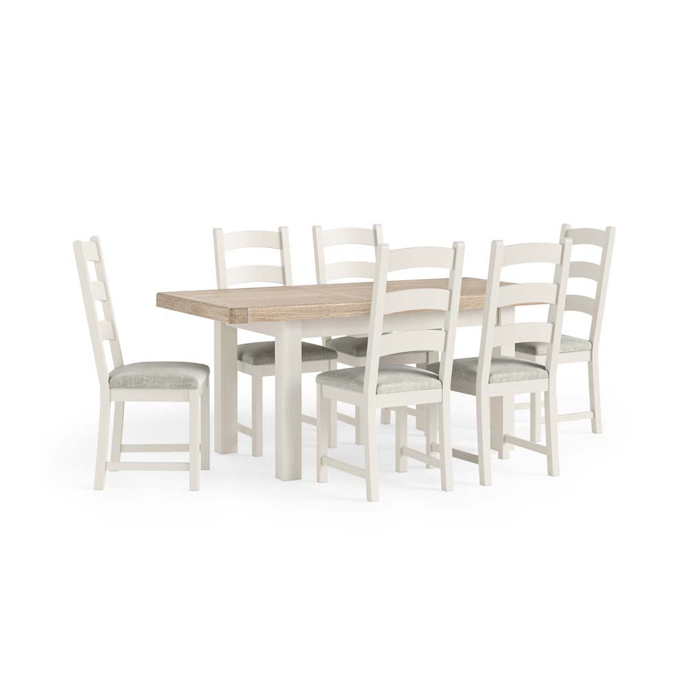 Dining table set with six chairs on a white background