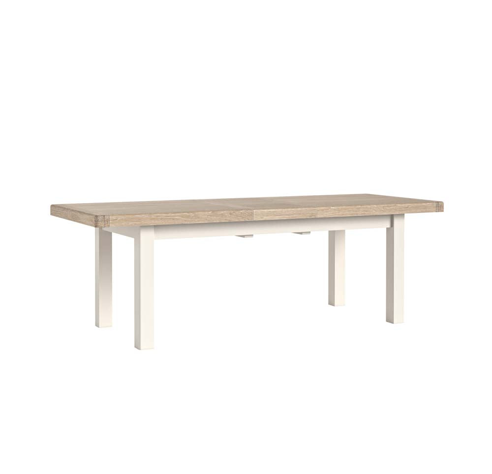Oak top extending dining table on a white background