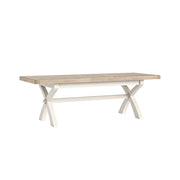 Oak dining table with white legs on a white background