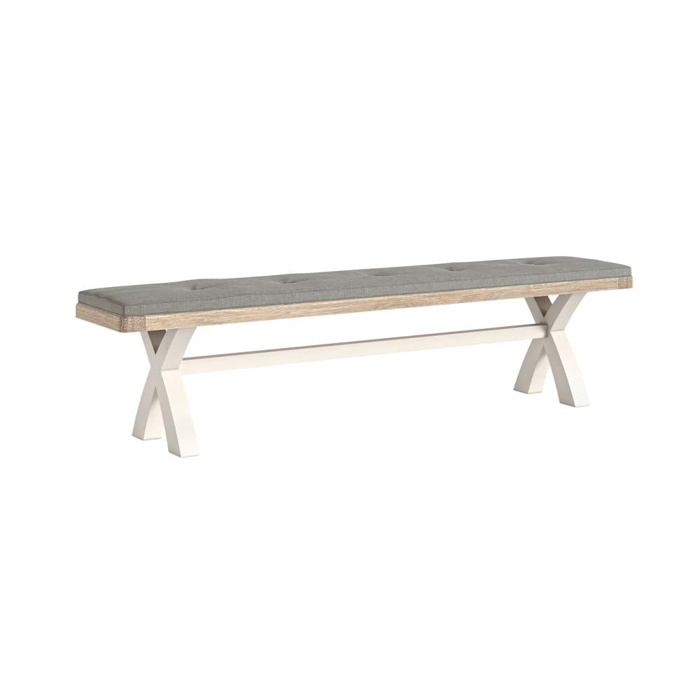 Oak cross leg dining bench with black cushion on a white background