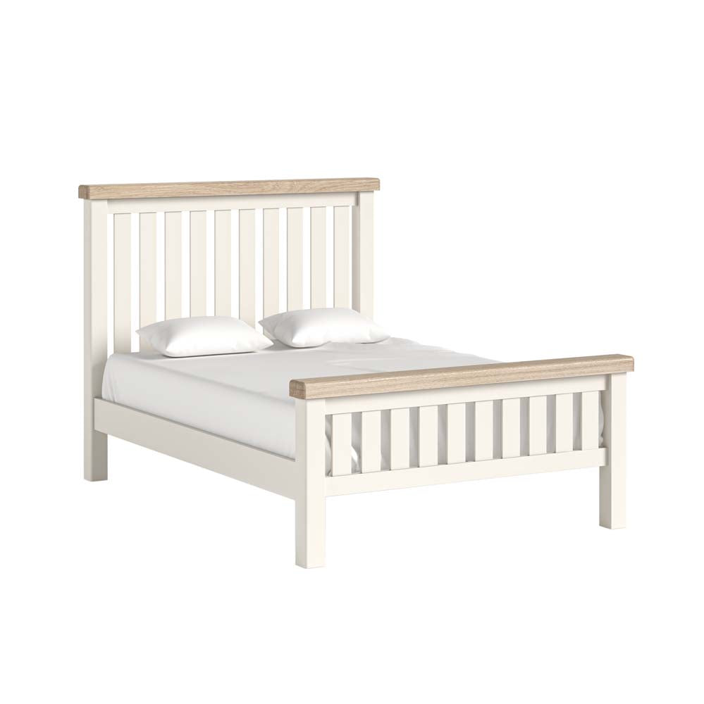 White and wood bed frame with white bedding on a white background