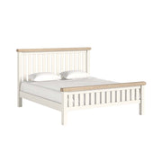White bed frame with wooden accents on a white background