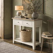Console table with decorative items in a room setting