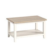 Wooden coffee table with a white base on a white background