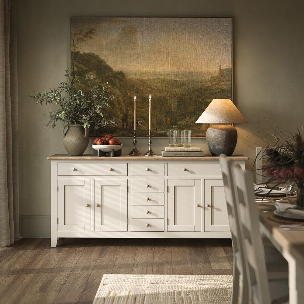 Coconut white sideboard in a living room with art and ornaments