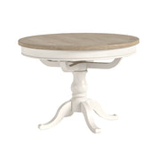 Round dining table with wooden top and white base on a white background