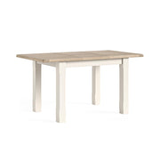 Rectangular table with light wood top and white base on a white background