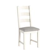 White chair with a gray cushion on a white background