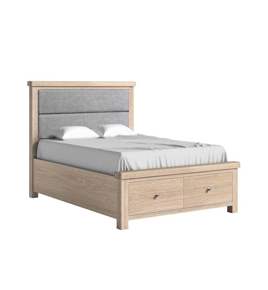 Wooden bed with gray upholstered headboard and drawers on a white background