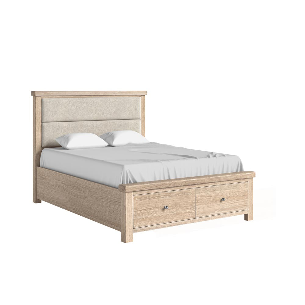 Wooden bed with upholstered headboard and drawers on a white background