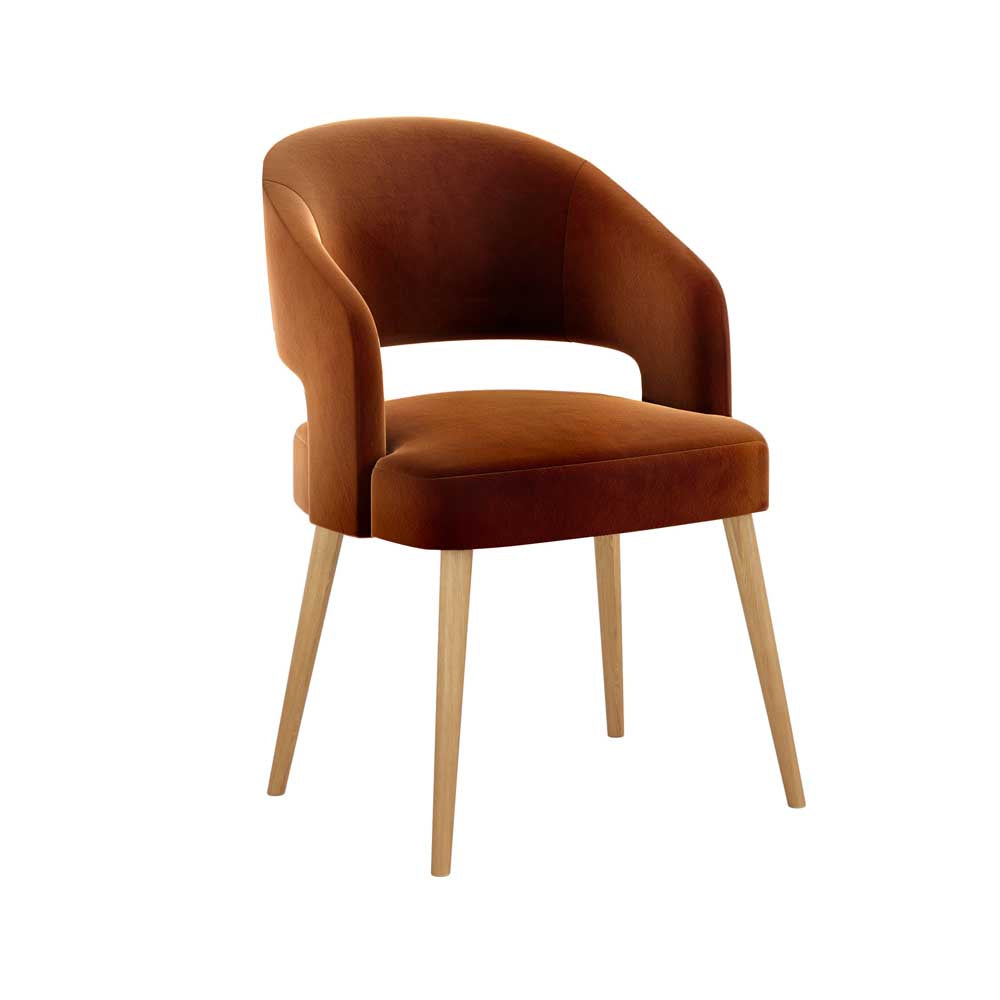 Rustic Orange velvet upholstered chair with wooden legs on a white background