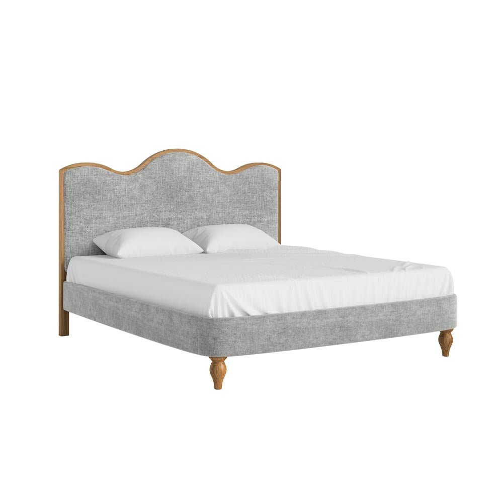 Gray upholstered bed with wooden frame and legs on a white background