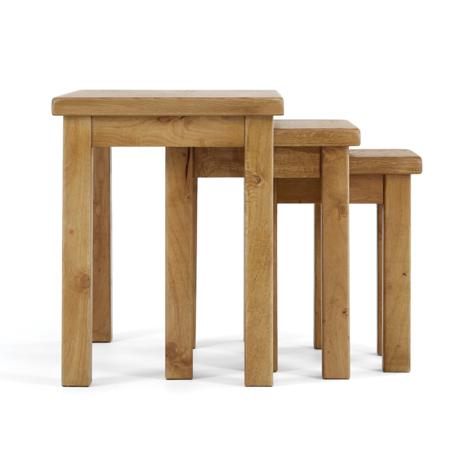side view of a nest of 3 oak tables