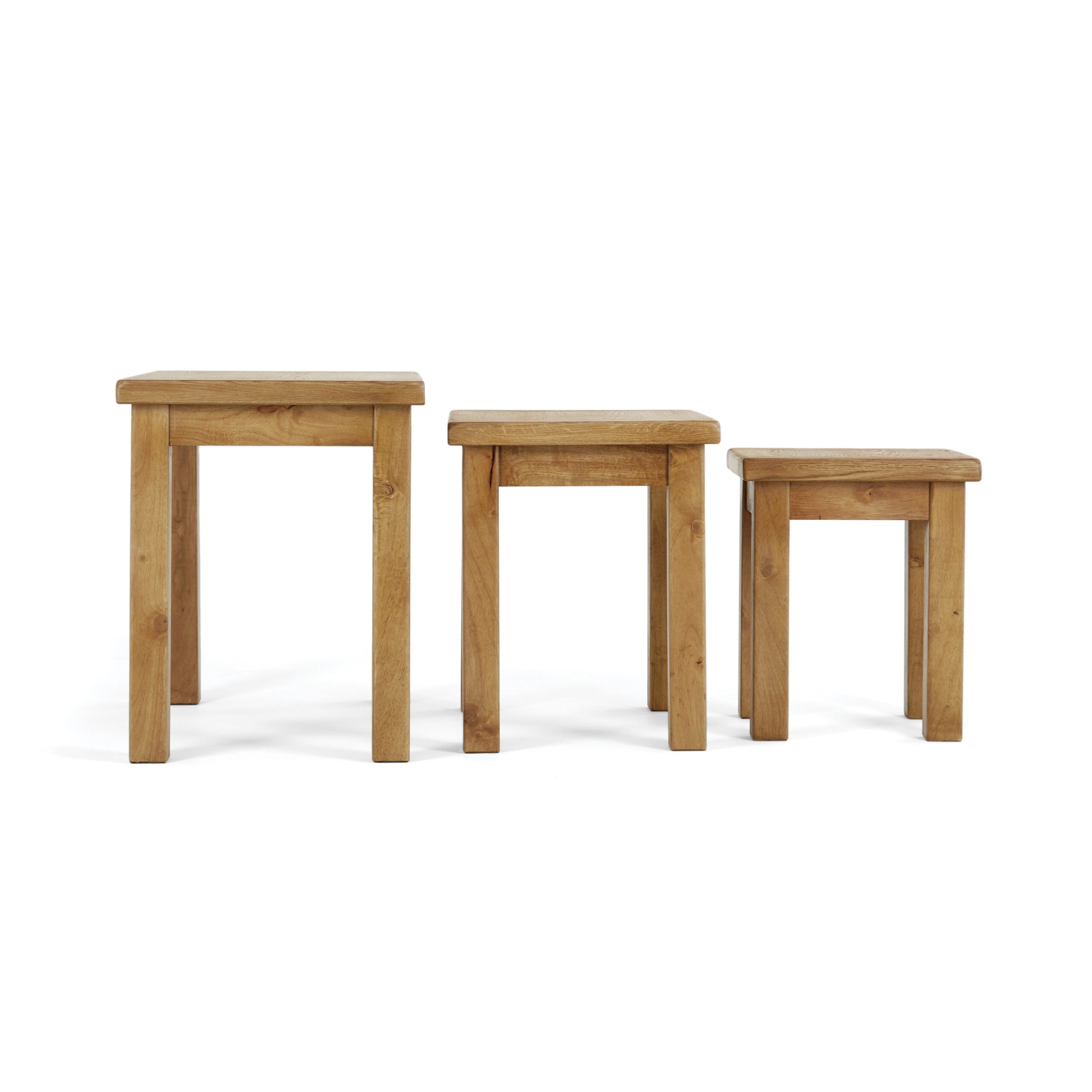 nest of 3 oak tables, all pictured next to each other so that you can see the sacle of each one