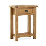 tall narrow oak telephone / colsole table with a single drawer and low storage shelf undernath. angled view.