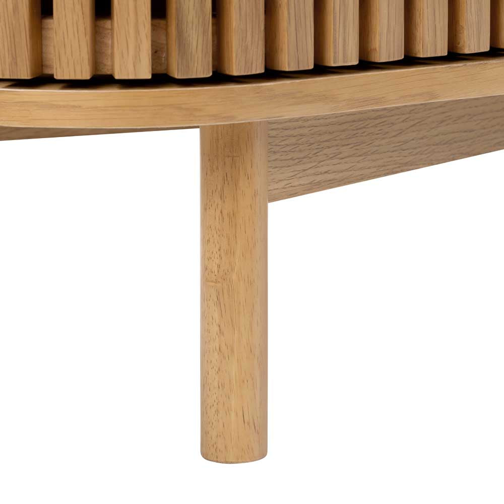Close-up of a wooden TV unit leg with slatted cupboard door just in view on a white background