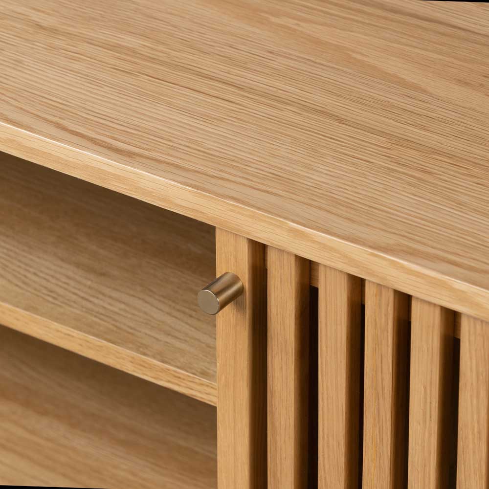 Wooden slatted design door with a metal handle on a TV unit.