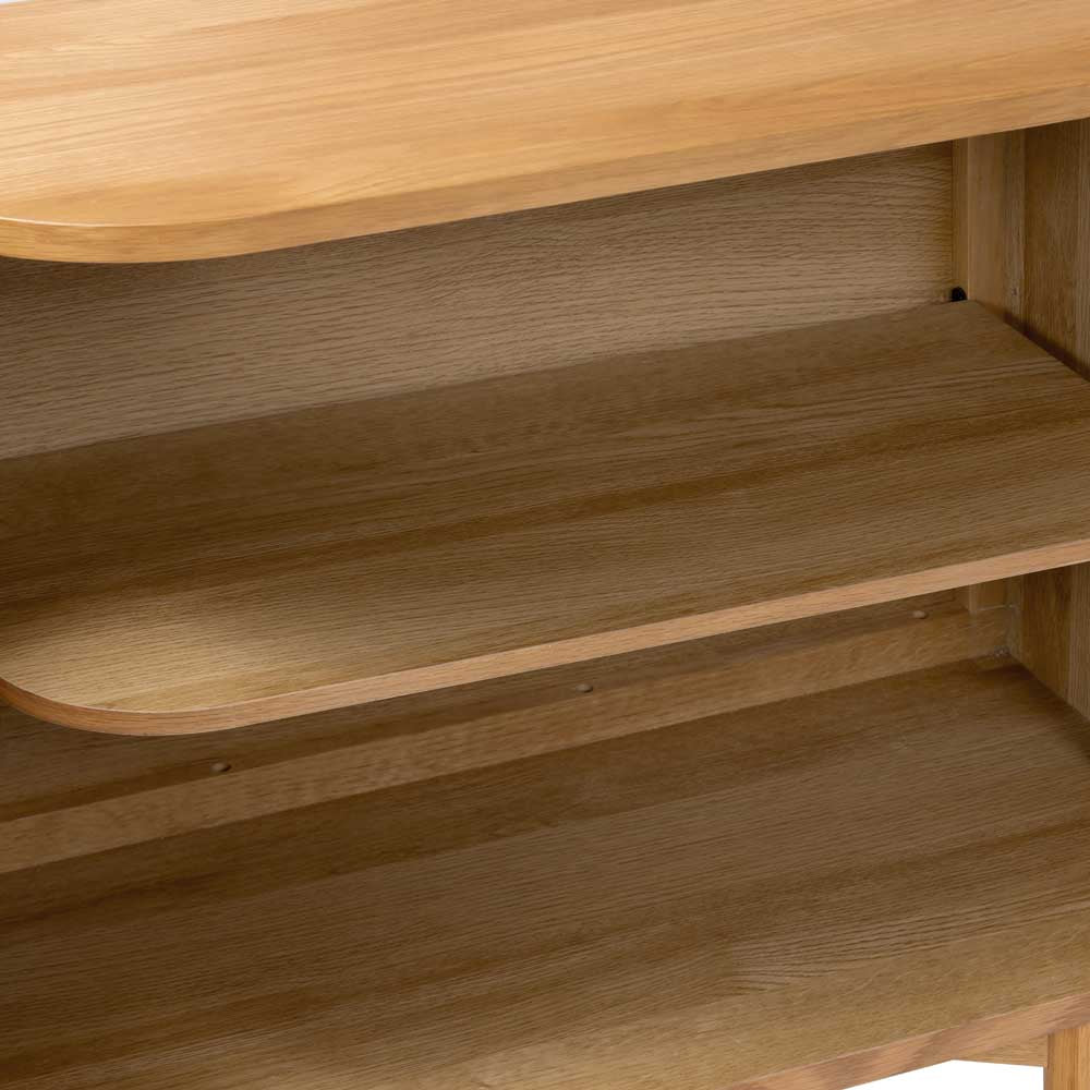 Close-up of a wooden shelf with a natural oak finish
