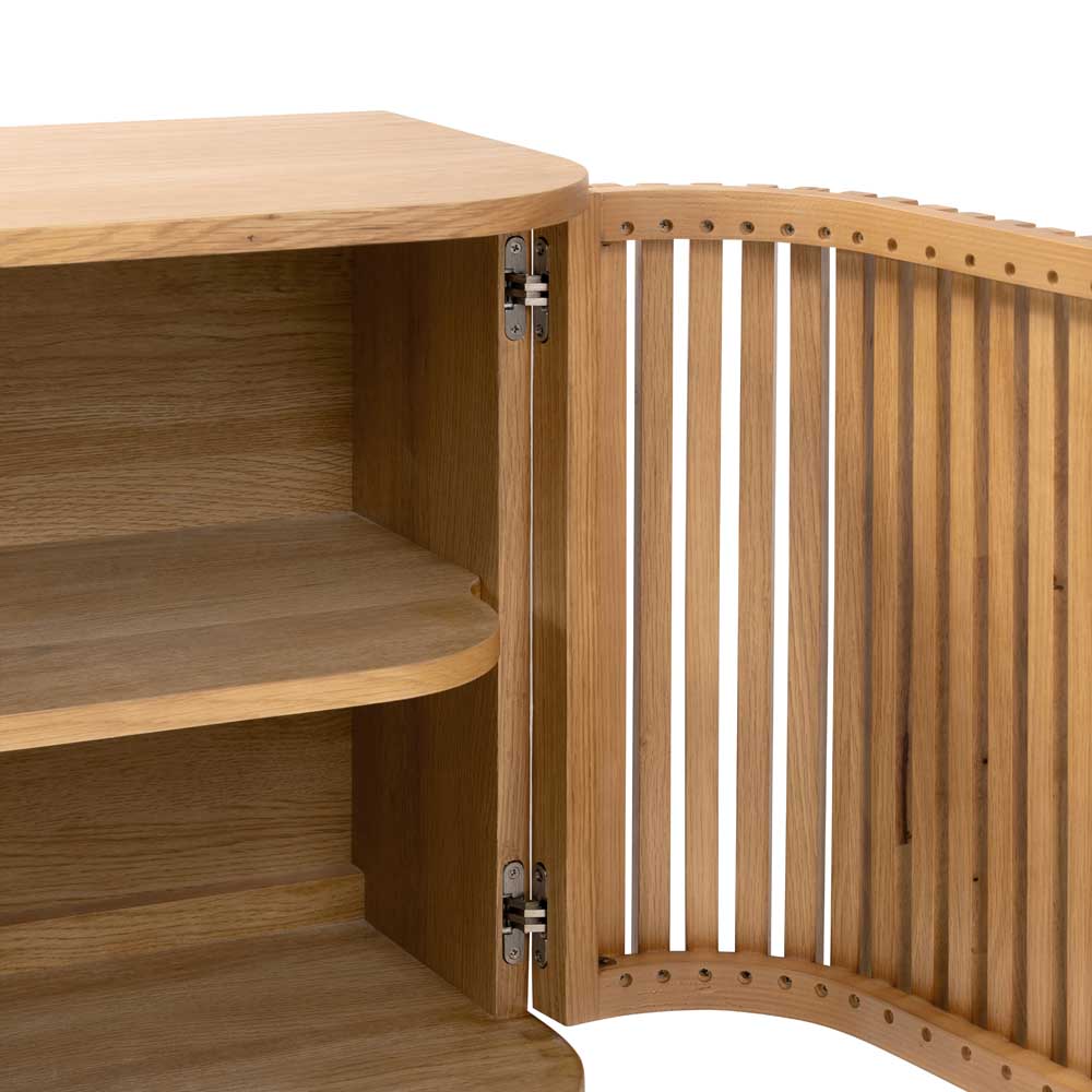 Close up of Wooden sideboard with open curved slatted door, showing hinges, on a white background