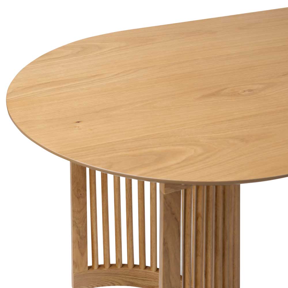 Oval dining table with curved slatted design leg
