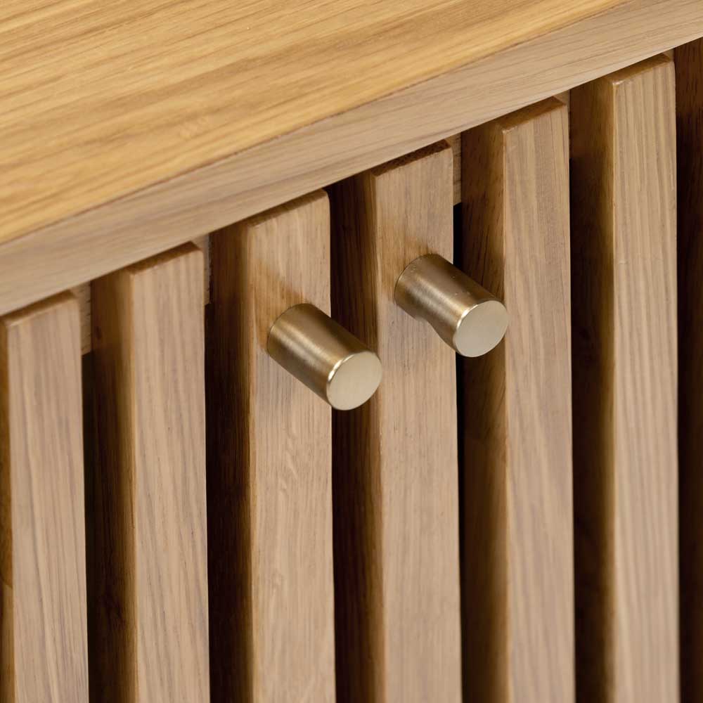 Wooden cabinet with gold effect hooks on a wooden background