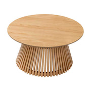 Wooden round table with a unique base design on a white background