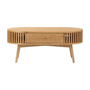 Wooden coffee table with a drawer and slatted design on a white background