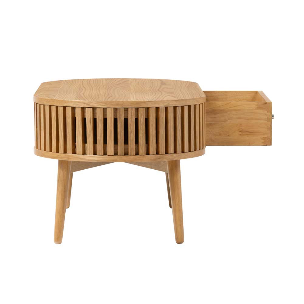 Wooden oval coffee table with a drawer on a white background