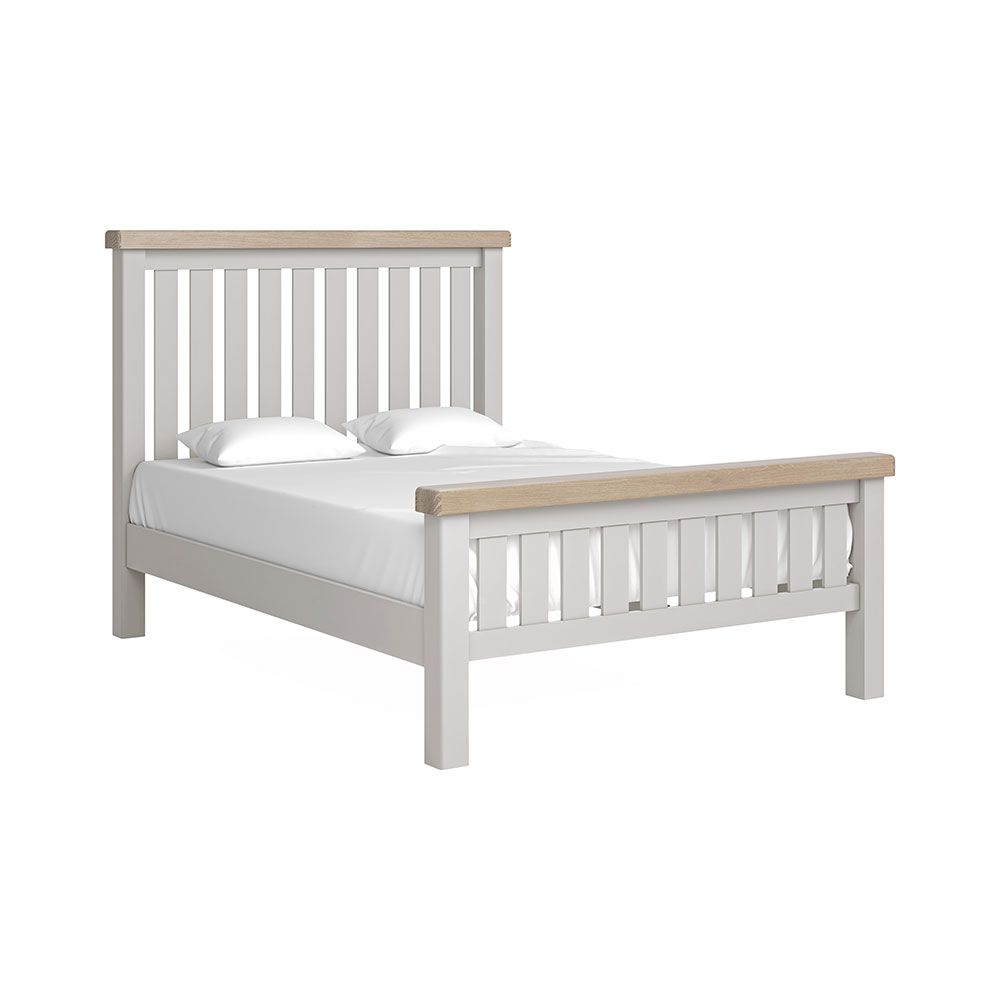Grey slatted double bedframe with white matress and pillow and oak tops on headboard and footboard