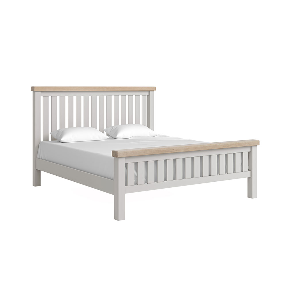Grey slatted super king bedframe with white matress and pillow and oak tops on headboard and footboard.