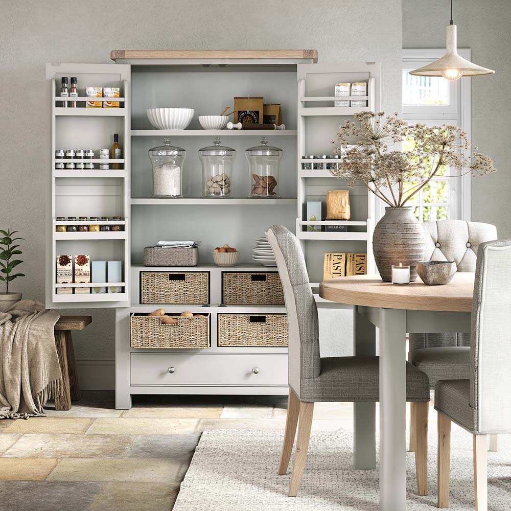 lifestyle image of double larder with all doors open and filled with ware, spices, condiments and showing off the internal storage baskets and storage wracks.