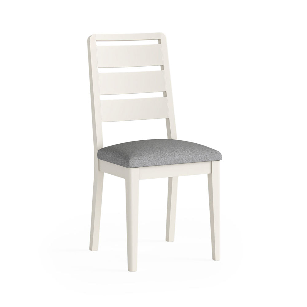 White painted oak dining chair with 3 horiszontal slats at the back and a grey cushioned seat.