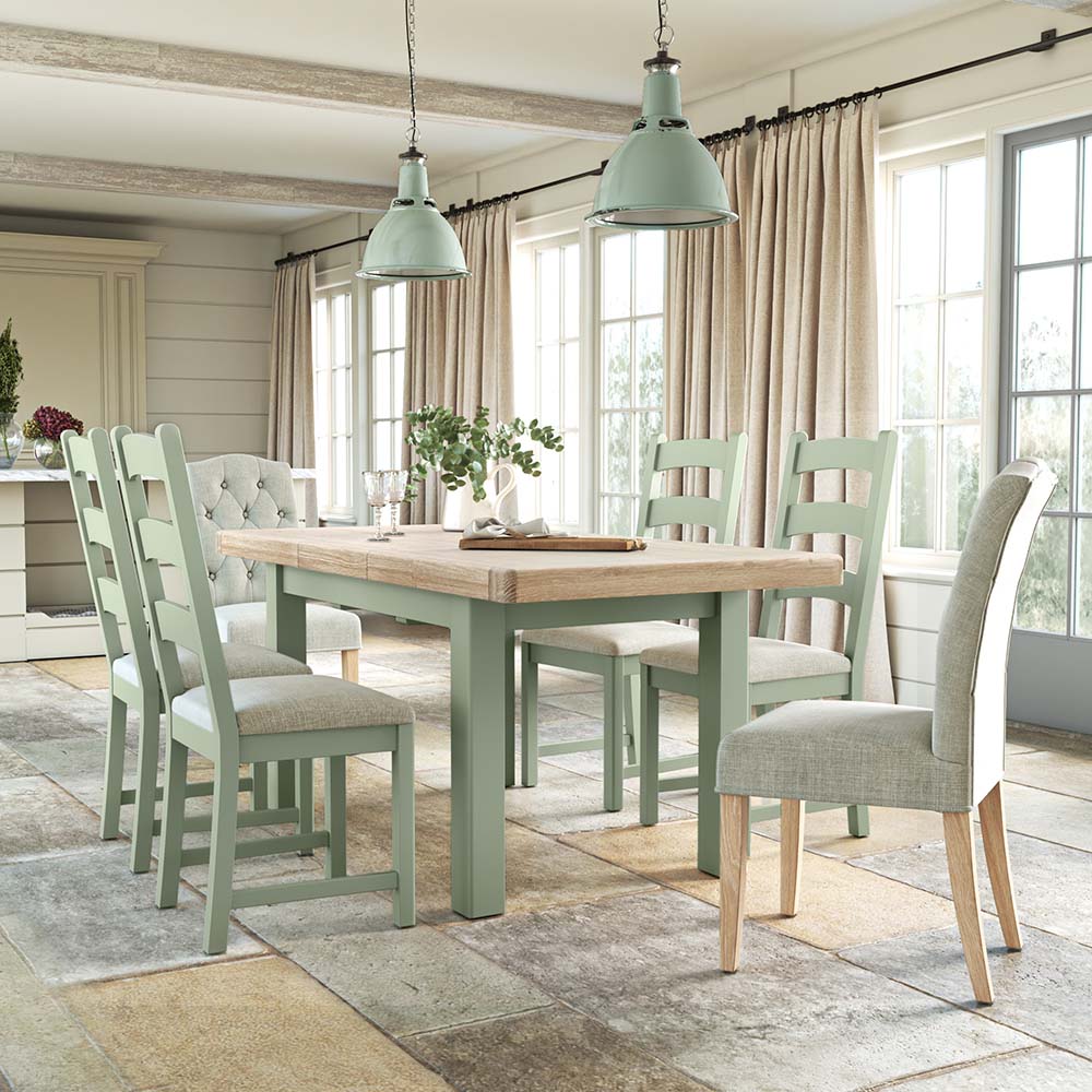 Image of kitchen with sage painted oak dining table and matching sage painted chairs.
