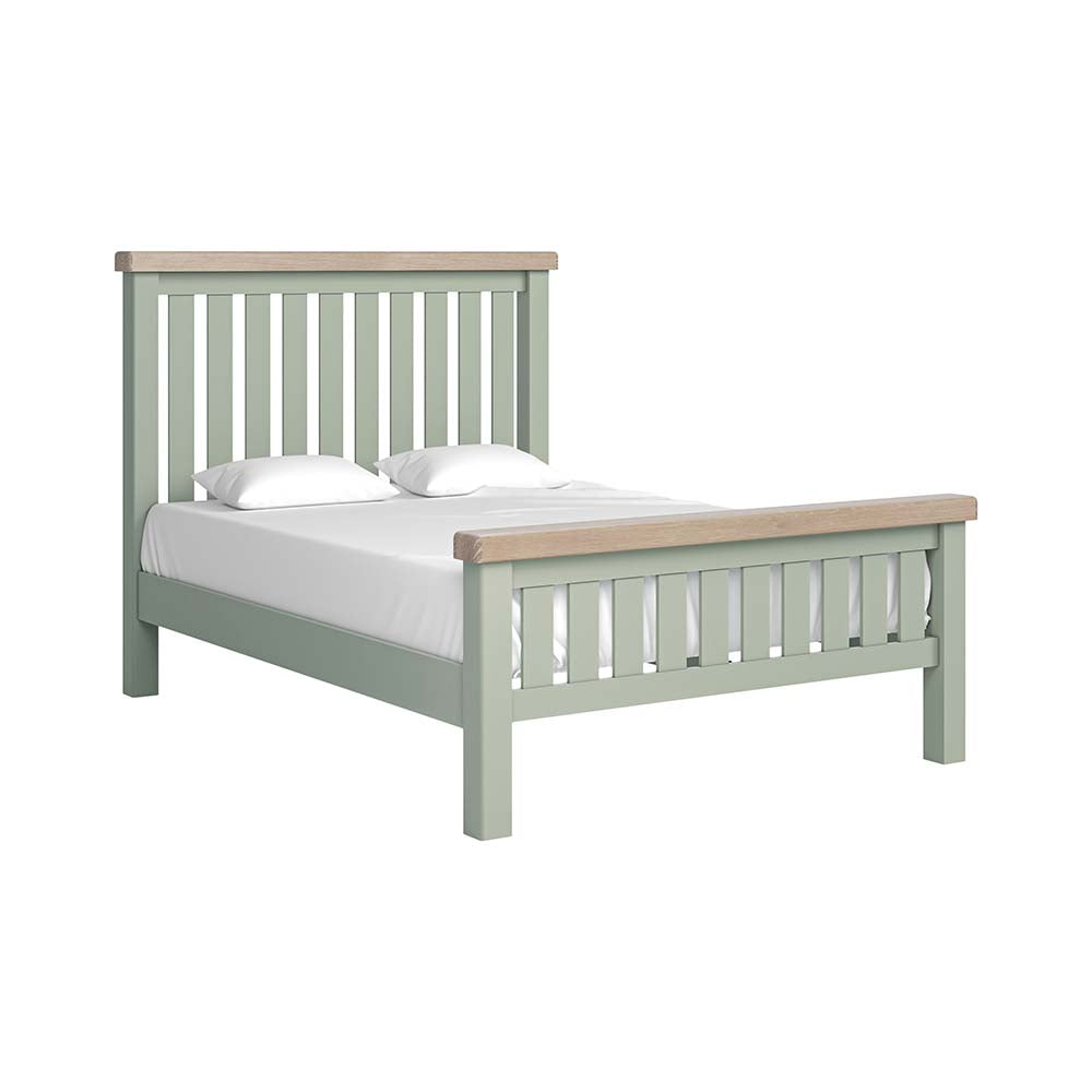 Sage slatted double bed with white matress and pillow and oak tops on headboard and footboard