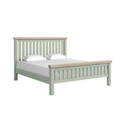Sage slatted super king bed with white matress and pillow and oak tops on headboard and footboard