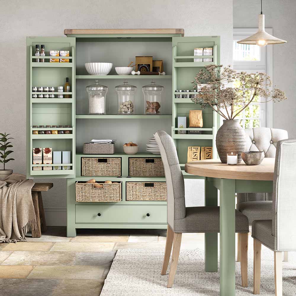 lifestyle image of double larder with all doors open and filled with ware, spices, condiments and showing off the internal storage baskets and storage wracks.