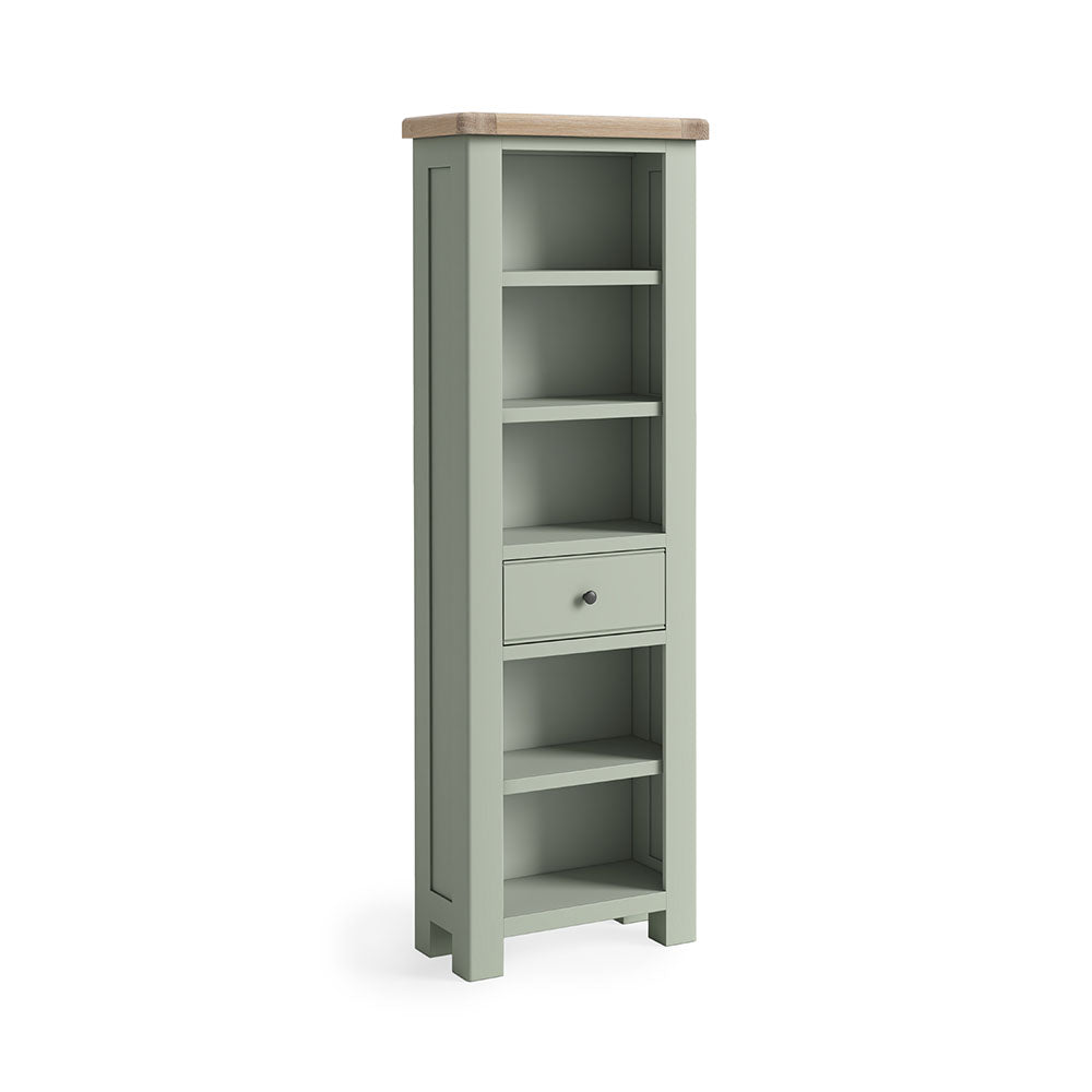 Sage green painted oak slim bookcase with 5 open shelves and one small drawer under the 3rd shelf.