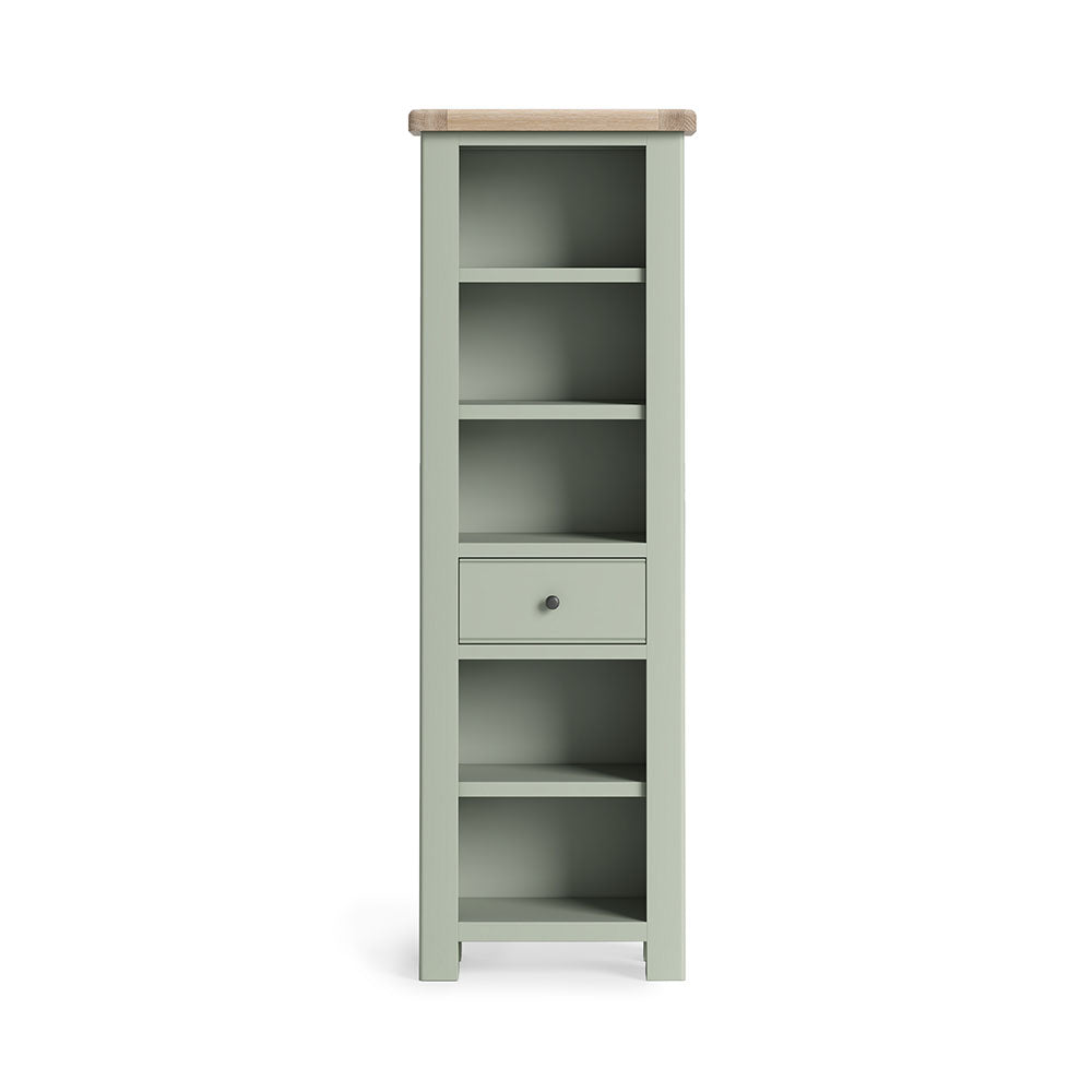Sage green painted oak slim bookcase with 5 open shelves and one small drawer under the 3rd shelf.
